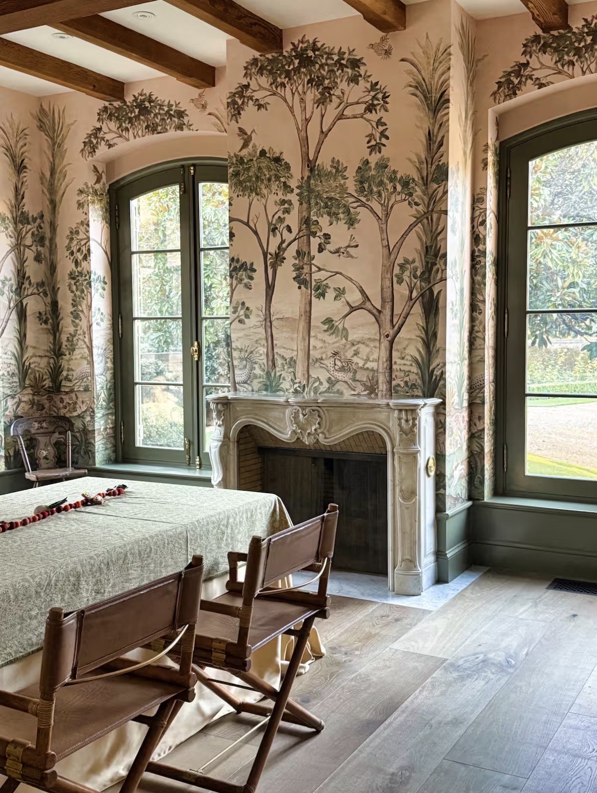 Dining room with mural wallpaper and fireplace